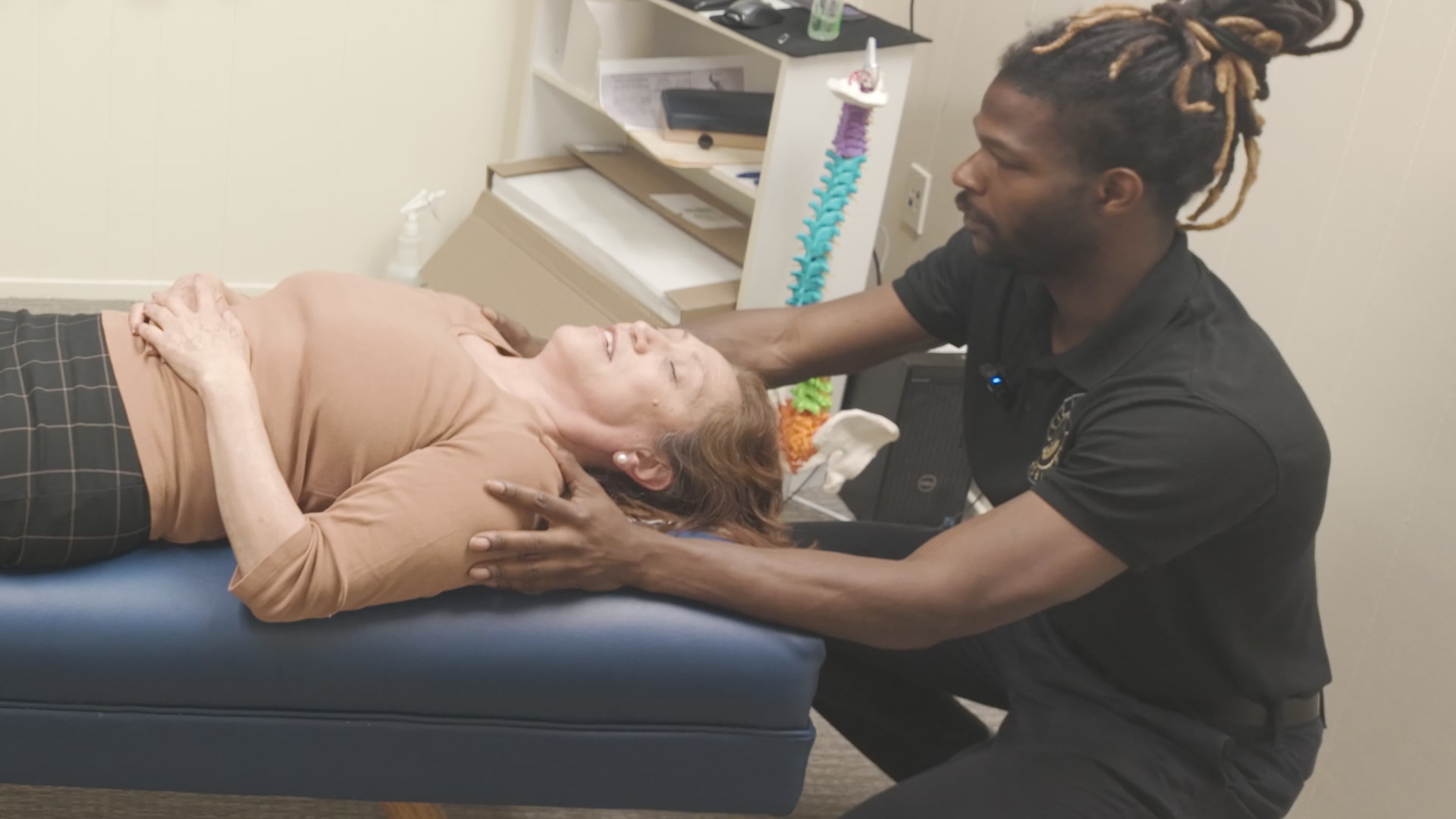 Dr. Kendell Jack assessing a patient jaw and upper neck at Impulse Life Chiropractic in Sebastopol